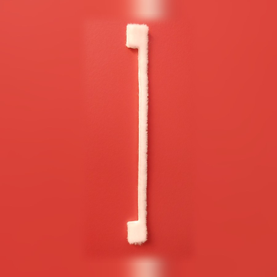 White foam Air-Plug that fits around a door catch