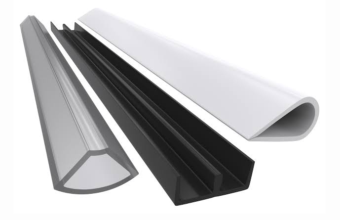 Custom extruded fenestration gasket and seal profiles in grey, black, and white