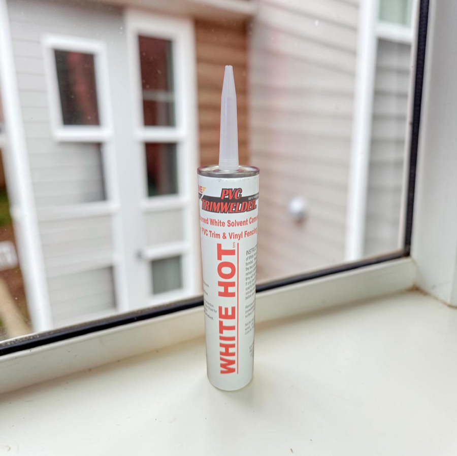 PVC Trimwelder White Hot solvent cement cartridge on a window sill