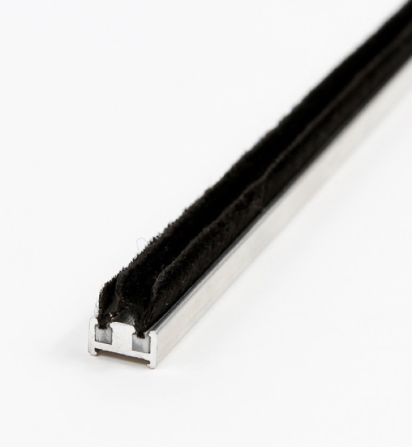 Pile weatherstrip installed on a door astragal