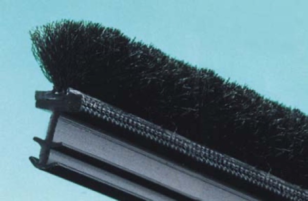 Kerf mounted pile weatherseal on extruded base profile